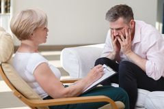 psychiatrist talking with her patient